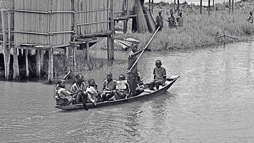 A photo by Sunmi Smart-Cole entitled: "School bus" boat in the Niger Delta, Nigeria