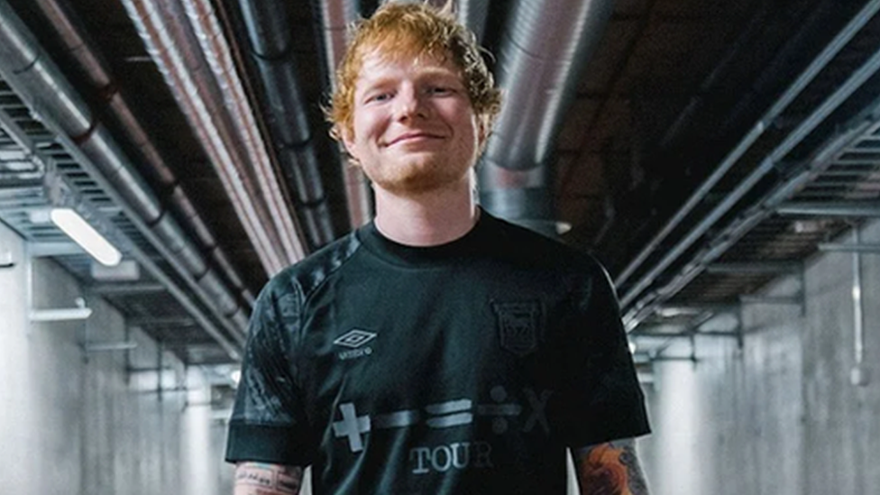 Ed Sheeran in Ipswich Town blackout kit