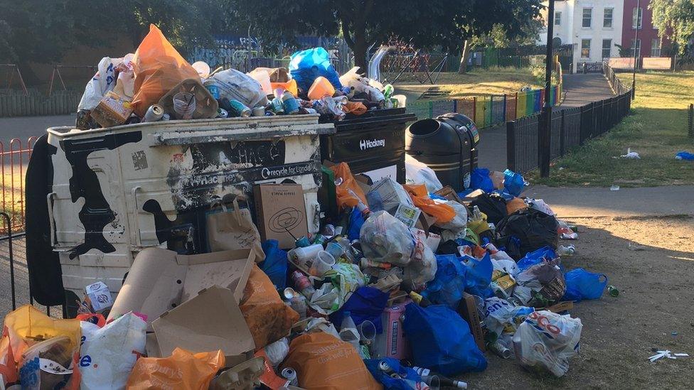 Overflowing rubbish bin