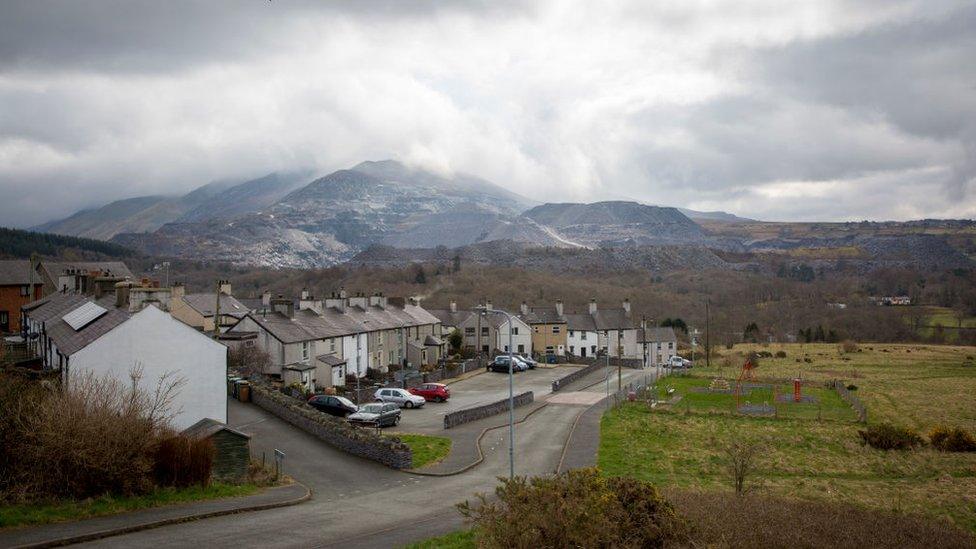 Bethesda today, terraced houses with views of the quarry workings behind them in the distance