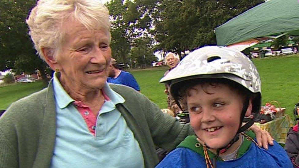 Rita Elsy and Riley Townsend at the end of his bike ride