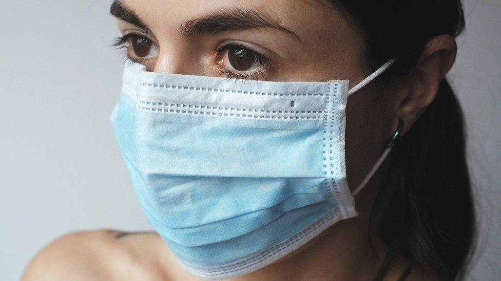 Woman in facemask (stock image)