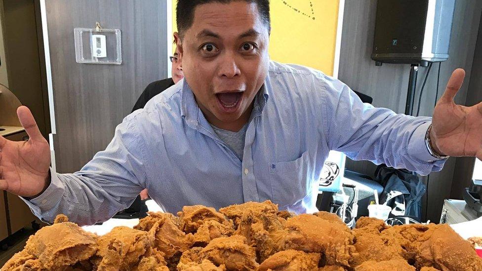 Winnipegger Ron Cantiveros with an oversized bucket of Jollibee fried chicken