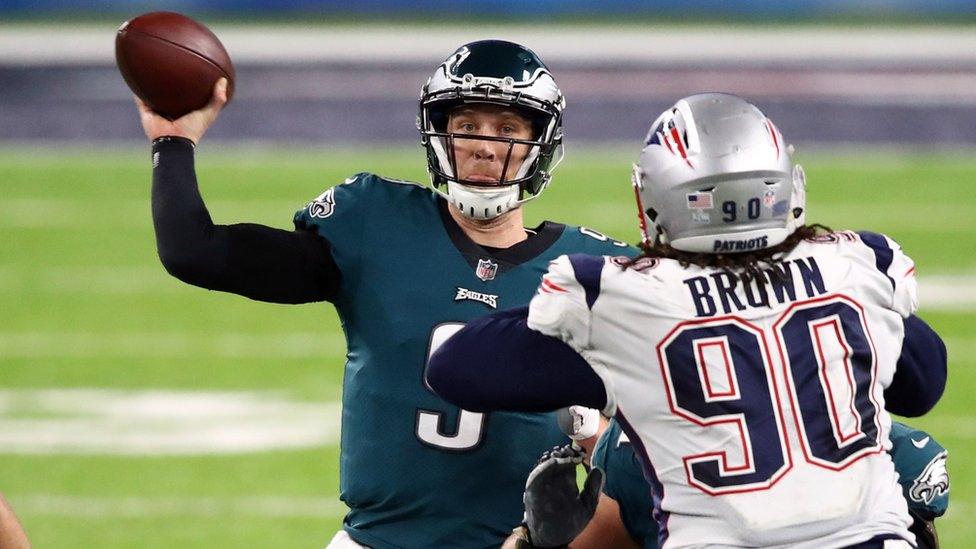 The Philadelphia Eagles quarterback Nick Foles throws a pass during the Super Bowl LII showdown