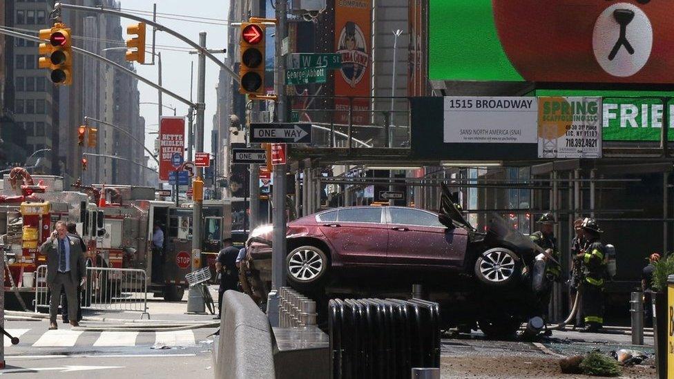 Emergency workers work at the scene after multiple people were injured when a vehicle struck numerous pedestrians in Times Square in New York City, New York, USA, 18 May 2017.