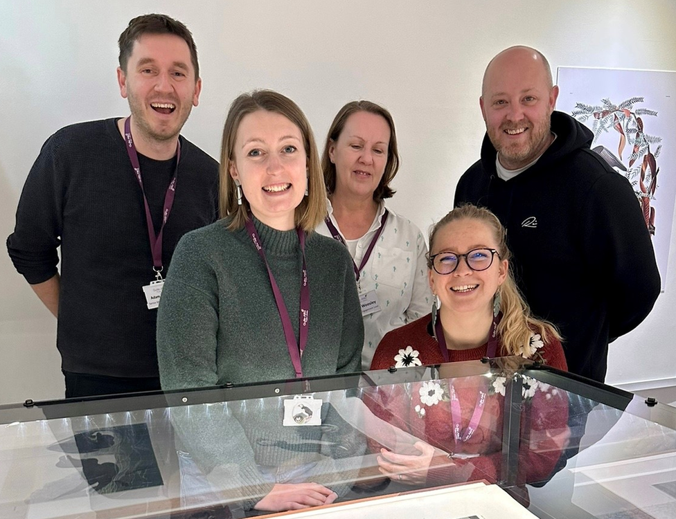 Guille-Allès Library staff behind a display case