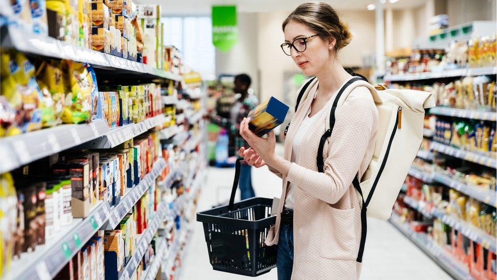 Woman shopping in supermarket