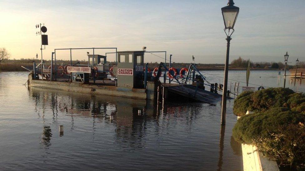 Reedham Ferry approaches its mooring on the north bank of the River Yare.