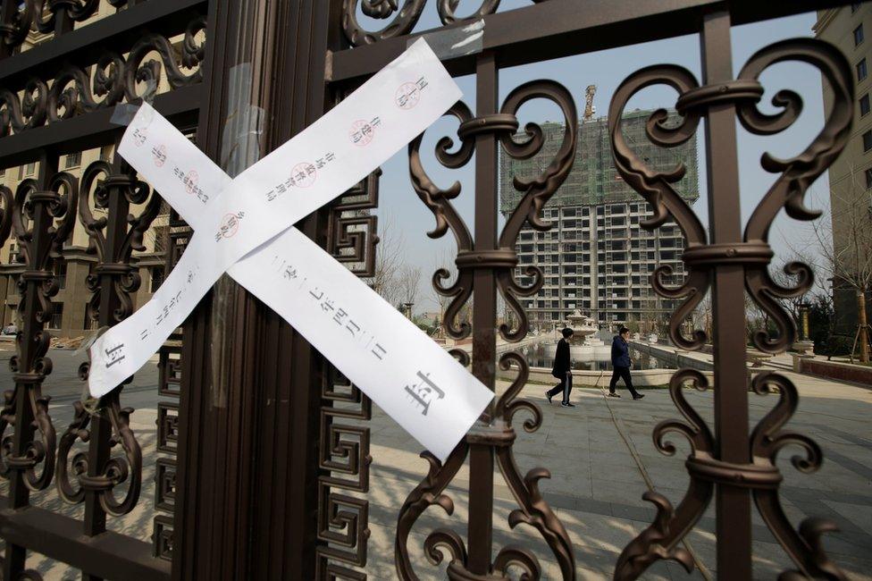 A seal is placed on the gates of a property as the government banned new property sales in counties earmarked as part of a new special economic zone in Xiongxian, Hebei province, China, 3 April 2017.