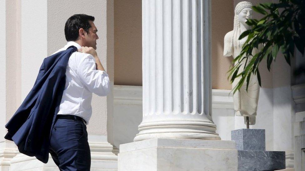 Greek Prime Minister Alexis Tsipras arrives at his office in Athens on 13 July