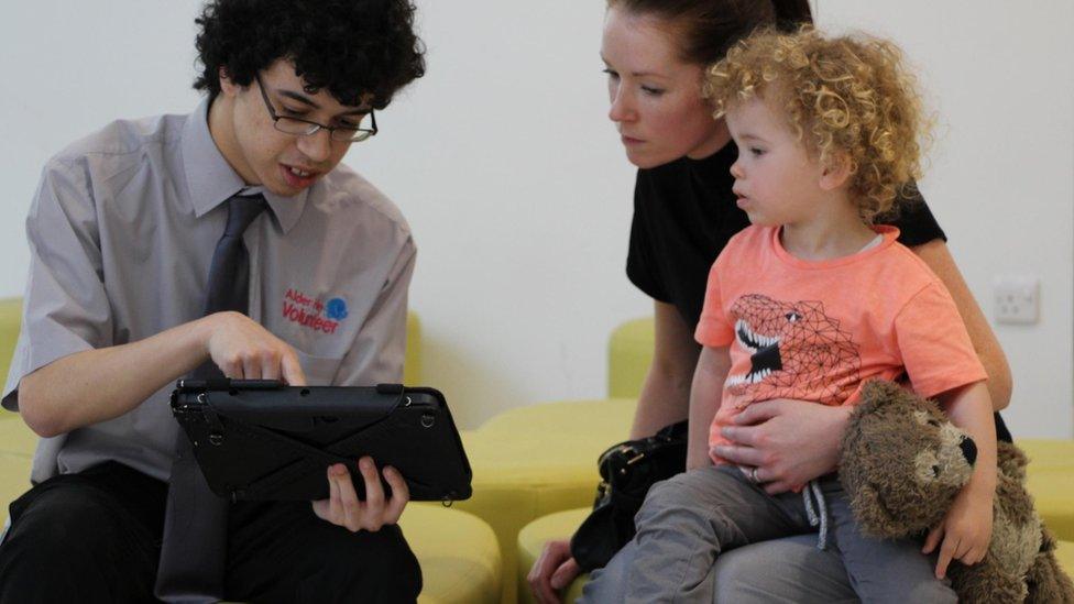 A volunteer with patient