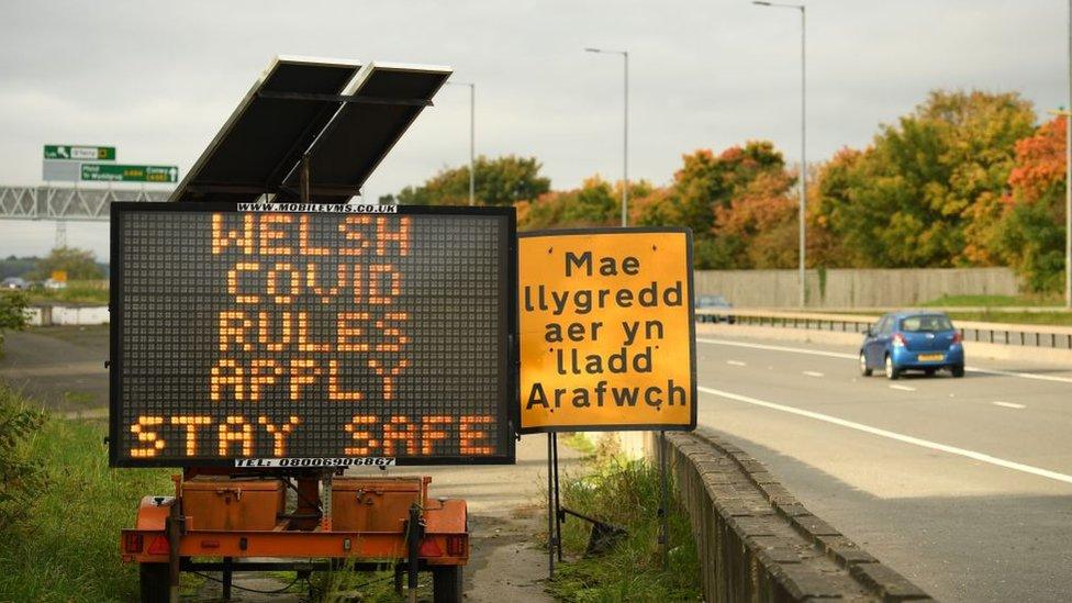 Welsh Covid Rules Apply sign near Wales-England border on Deeside, Flintshire