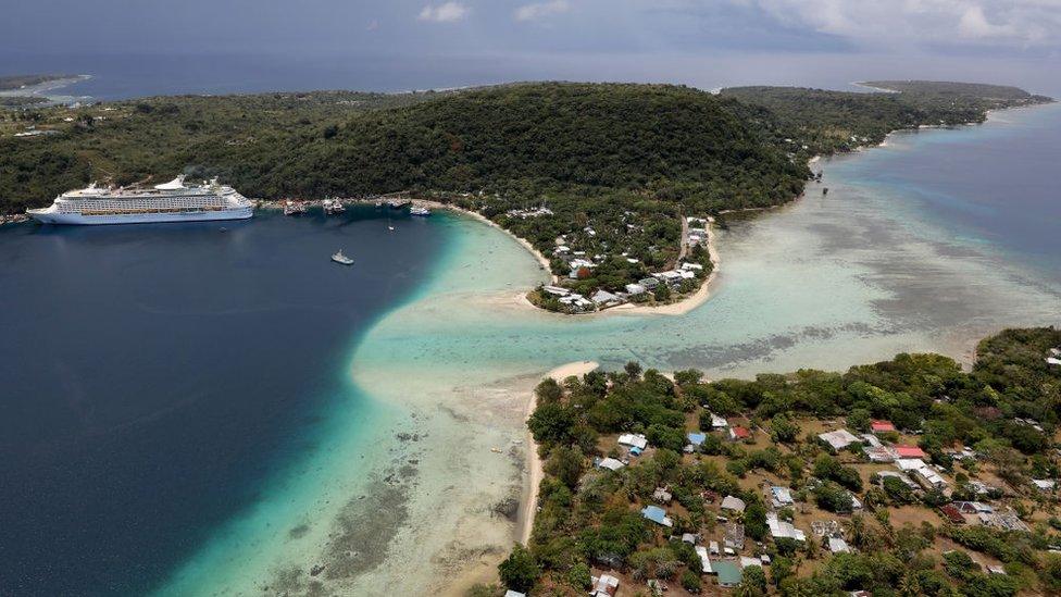 An aerial view of a cruise ship docked on December 07, 2019 in Port Vila, Vanuatu. Tourism is a mainstay of the economy