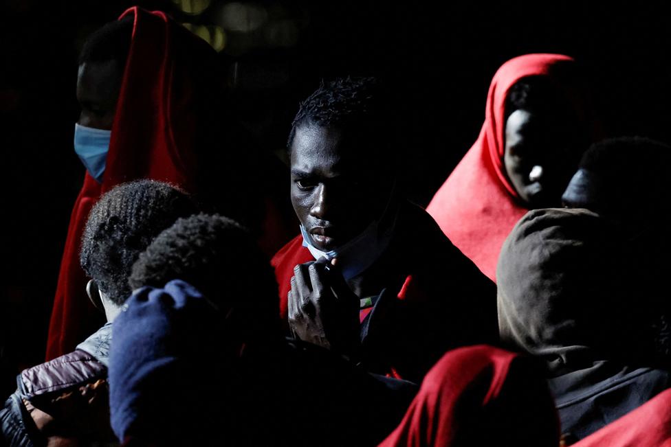 Migrants wait to disembark from a Spanish coast guard vessel, in the port of Arguineguin, at the island of Gran Canaria, Spain, May 25, 2023.