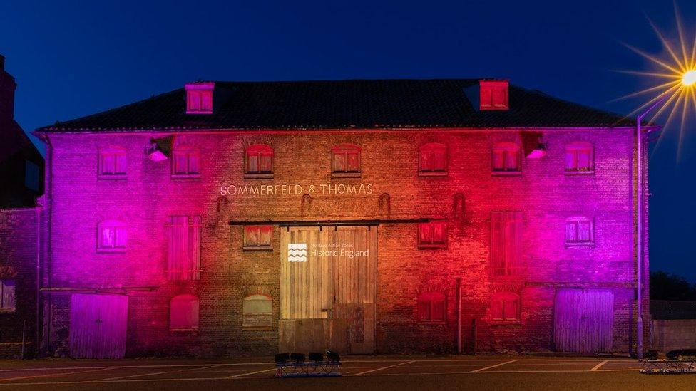 Sommerfeld & Thomas building in King's Lynn illuminated at night