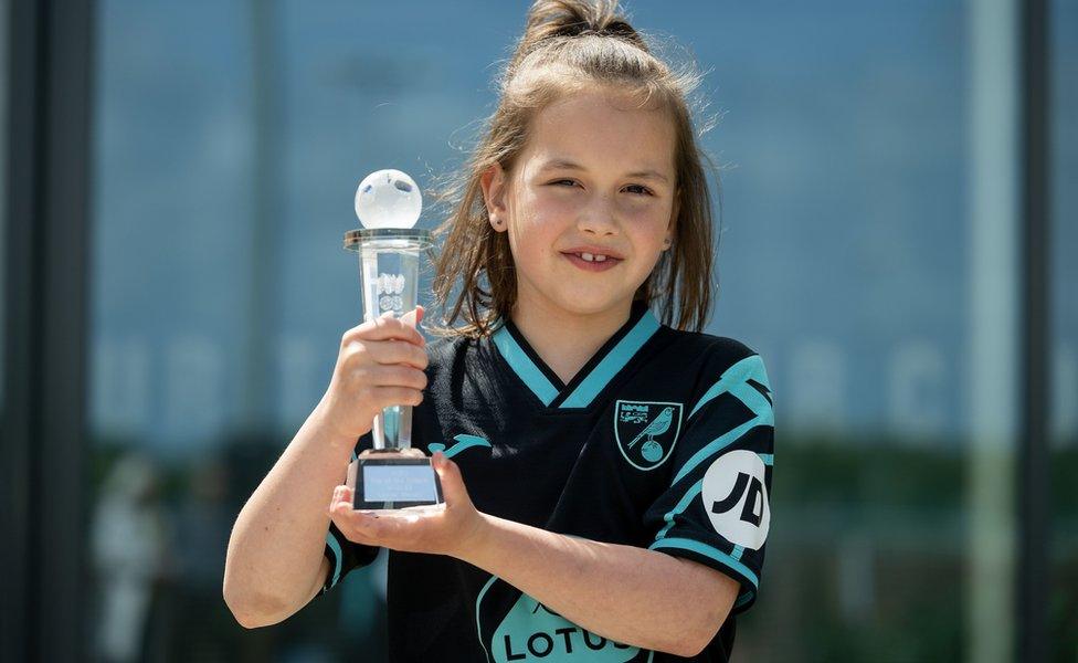 Amber Sheehy with the Norwich City Football Club Fan of the Season award