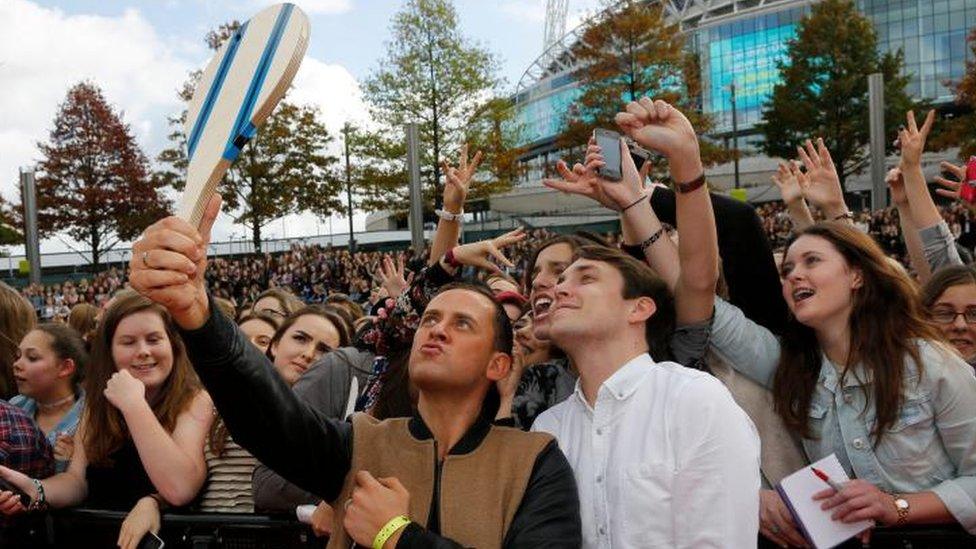 Scott Mills and Chris Stark posing for a selfie on the red carpet at the BBC Radio 1 Teen Awards in 2014