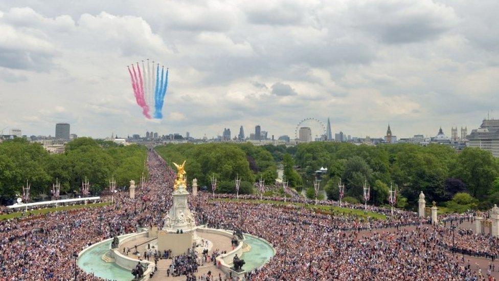 The RAF fly-past roared down The Mall and over the top of Buckingham Palace to cheers from the crowd below.