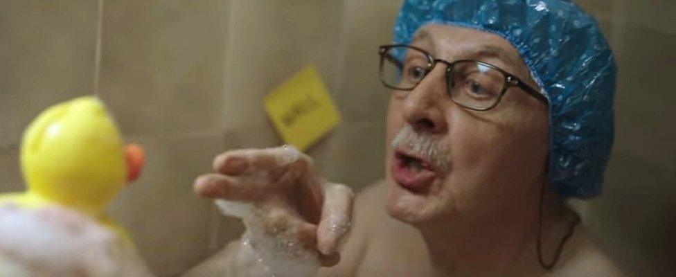 A screen shot from the advert shows the grandfather threatening a rubber duck