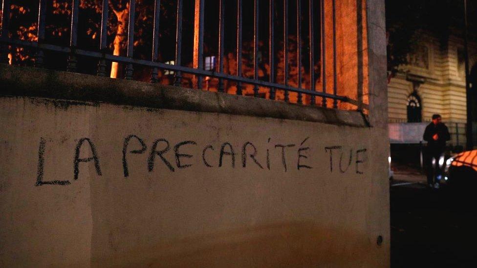 The phrase meaning "insecurity kills" spray-painted on a wall of the higher education ministry in Paris