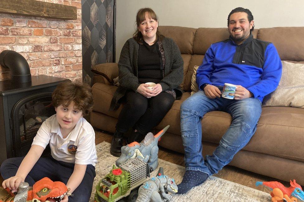 Hayley and Elvin Cartagena at home with their son, Benjamin