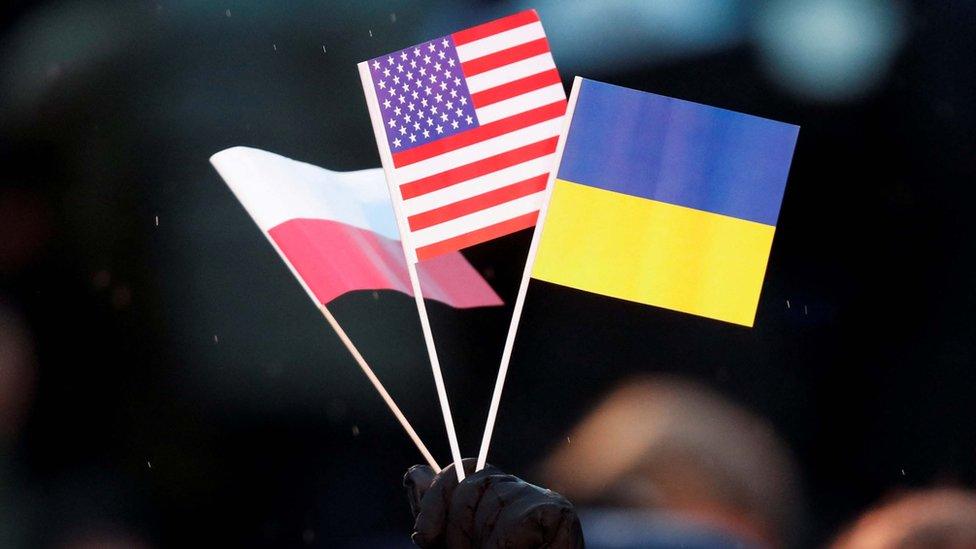 A Polish, US and Ukrainian flag