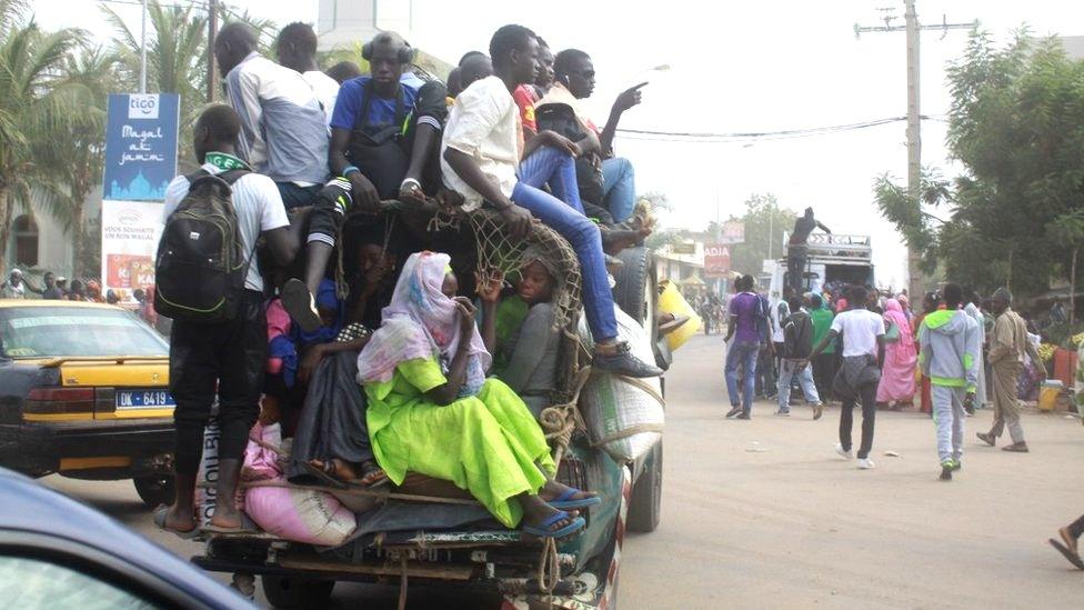 Passengers in a crowded car