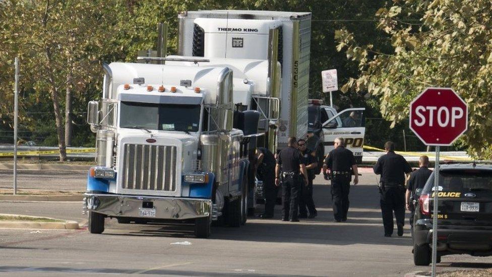 Officials tow a truck that was found to contain 38 suspected illegal immigrants in San Antonio, Texas, USA, 23 July 2017.