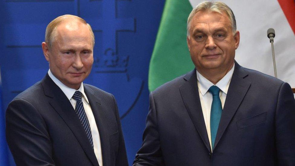 Hungarian Prime Minister Viktor Orban (R) and Russian President Vladimir Putin shake hands after a press conference at the residence of the prime minister office in Budapest on October 30, 2019.