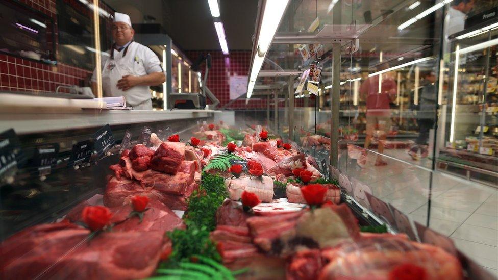 Meat is displayed in a French supermarket