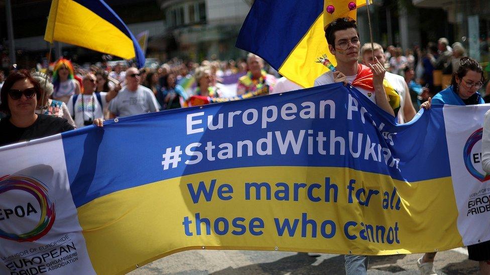 people hold banner saying "we march for those who cannot"