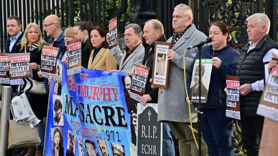 Families of Troubles victims stand outside Belfast's High Court