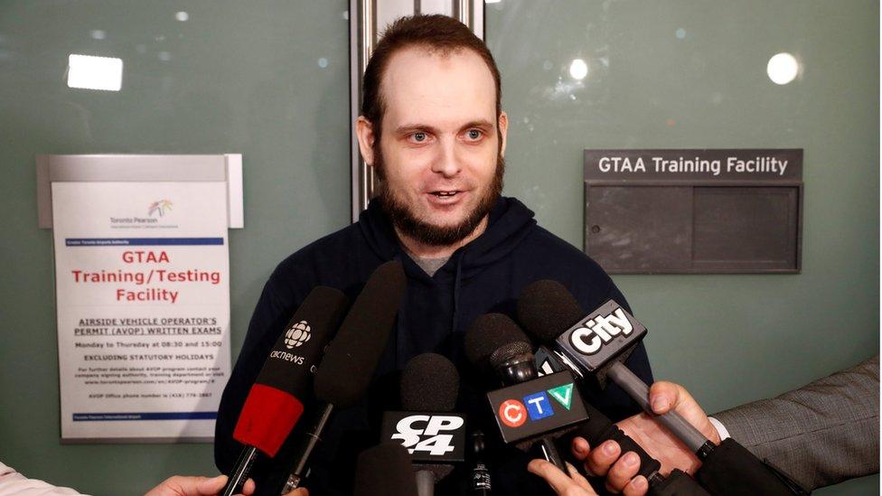 Joshua Boyle speaks to the media after arriving with his wife and three children to Toronto Pearson International Airport,