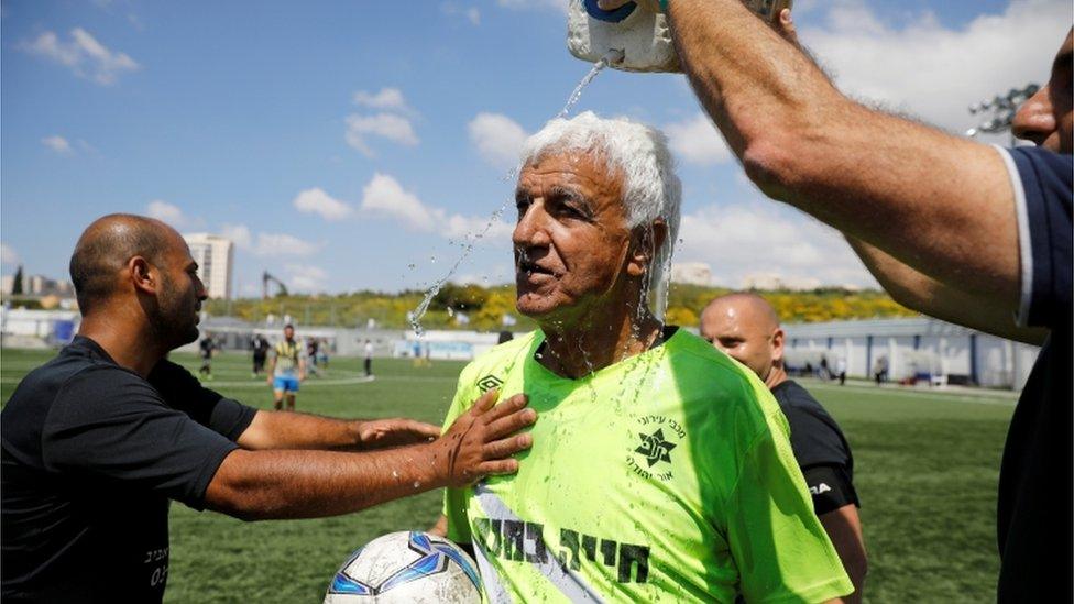 Isaak Hayik, the world's oldest football player, seen cooling off after playing for his team Ironi Or Yehuda