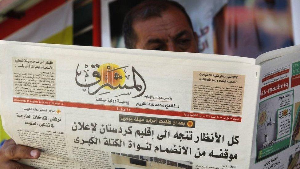 An Iraqi man reads a newspaper in the capital Baghdad, August 2018