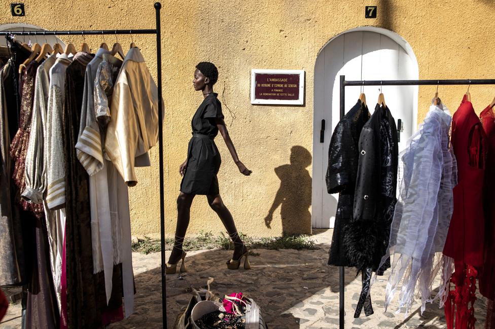 A model practises her walk ahead of Dakar fashion week on Goree Island in Dakar, Senegal.