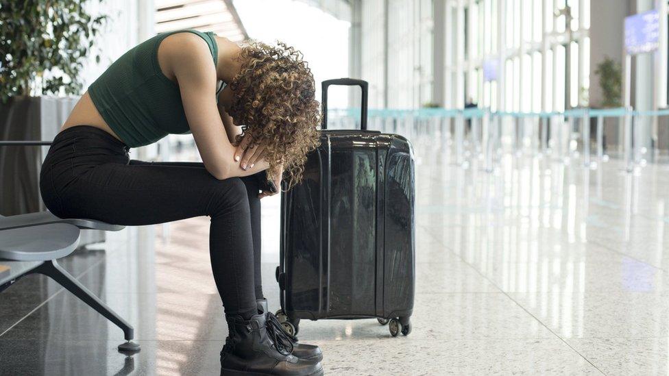 Woman in despair on a station