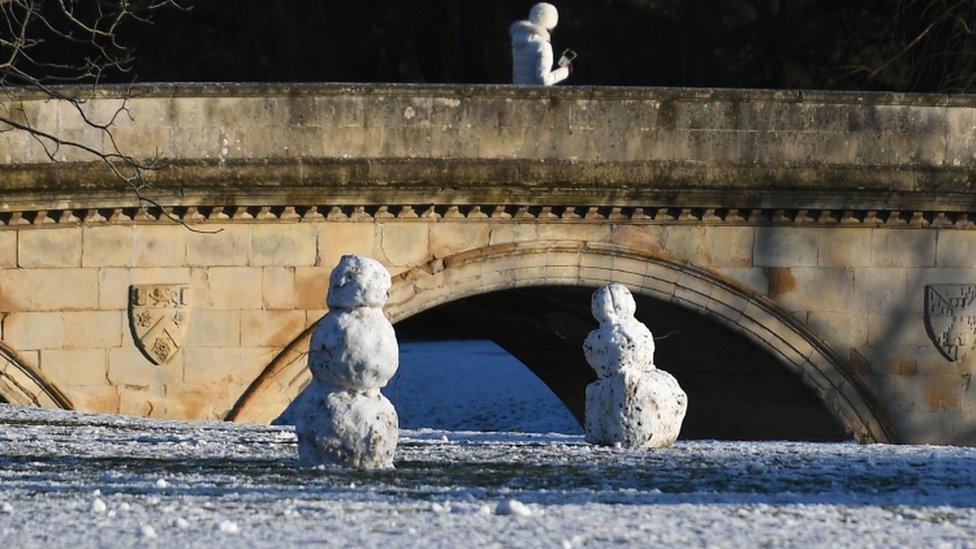 Snowmen on the banks of the River Cam in Cambridge