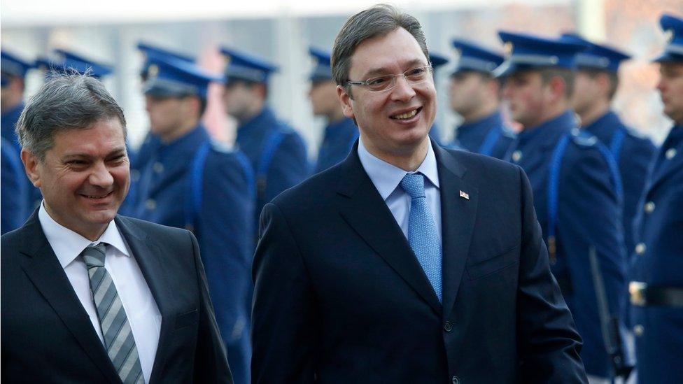 Serbian Prime Minister Aleksandar Vucic, right, accompanied by Bosnian Council of Ministers chairman Denis Zvizdic