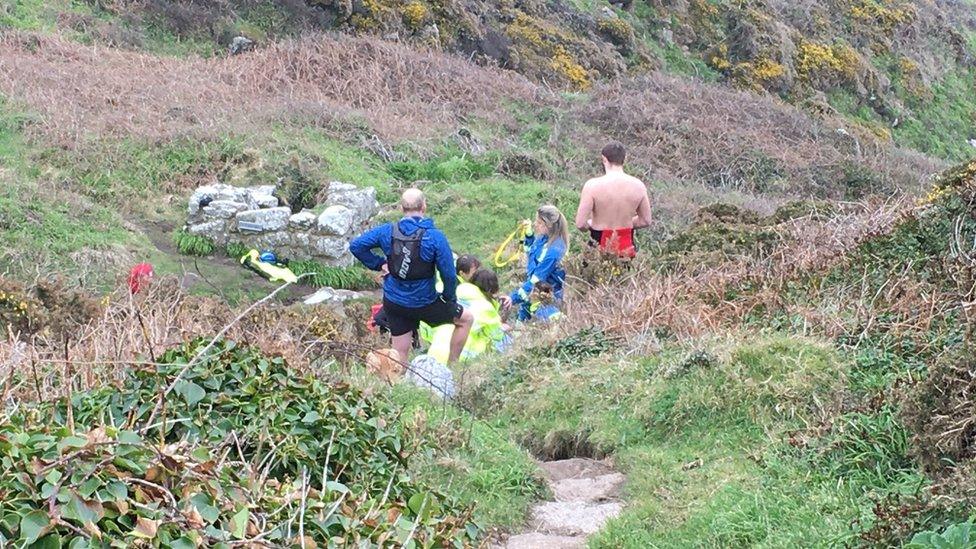 Coastguard rescue teams providing treatment