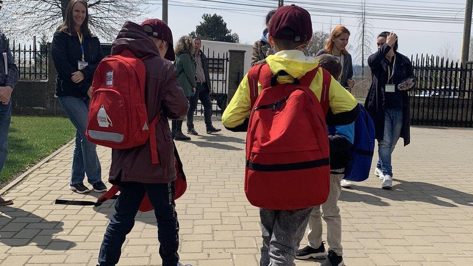 Children with backpacks in Romania