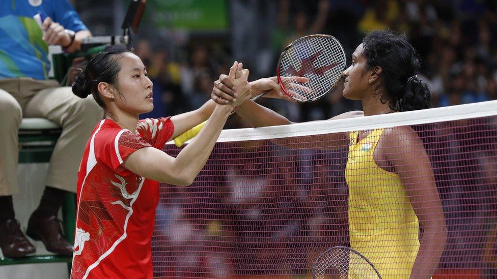 India"s Sindhu Pusarla, right, greet by China"s Wang Yihan after winning the Women"s Singles Quarterfinal at the 2016 Summer Olympics in Rio de Janeiro, Brazil, Tuesday, Aug. 16, 2016.