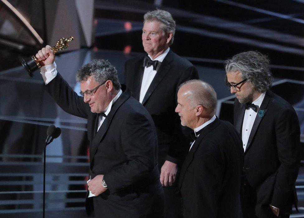 John Nelson, Paul Lambert, Richard R. Hoover and Gerd Nefzer accept their Oscar onstage