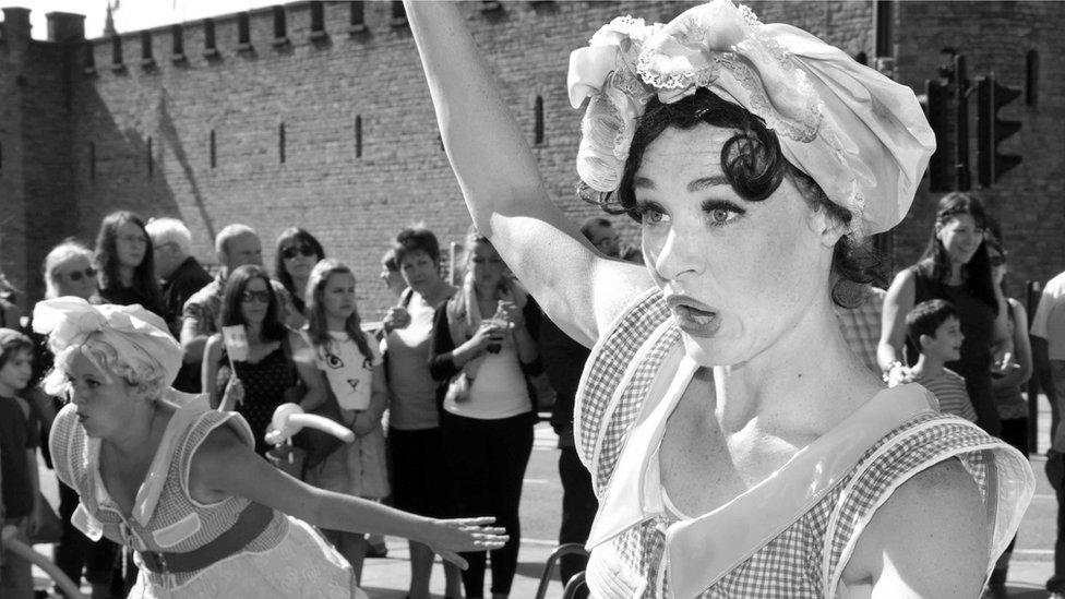 A woman dancing at the Cardiff Carnival, outside Cardiff Castle