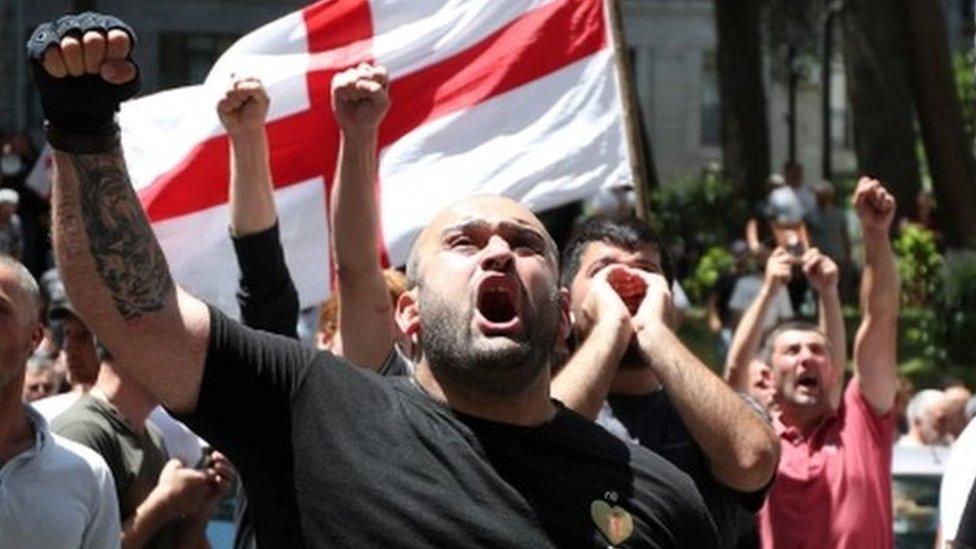 Anti-LGBT protesters shout during a demonstration in Tbilisi