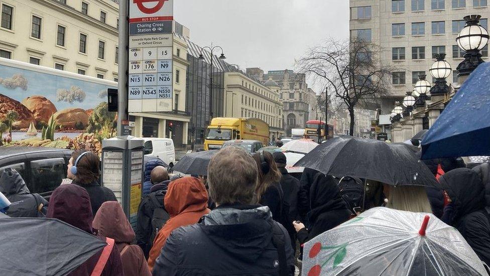 Bus passengers queuing