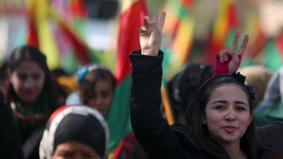 Kurdish people take part in a protest in the Syrian city of Derbasiya (9 February 2016)