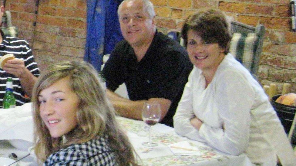 The family sitting at a table