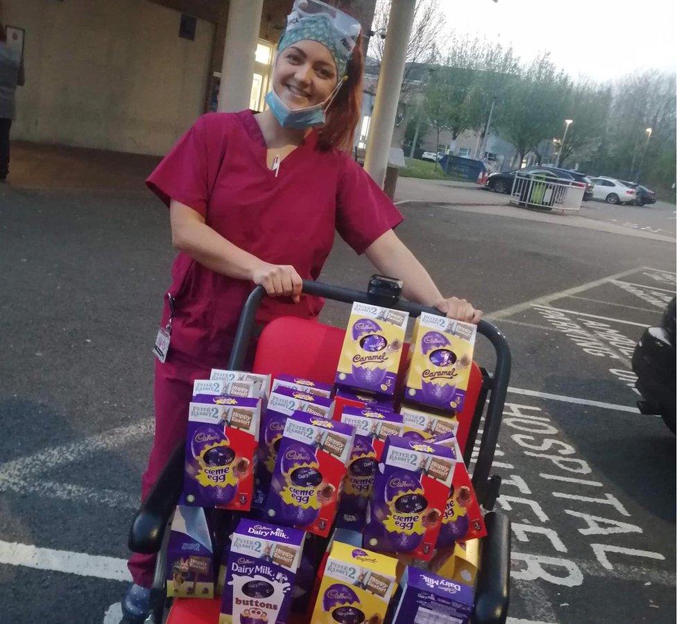 NHS staff member receiving donated Easter eggs