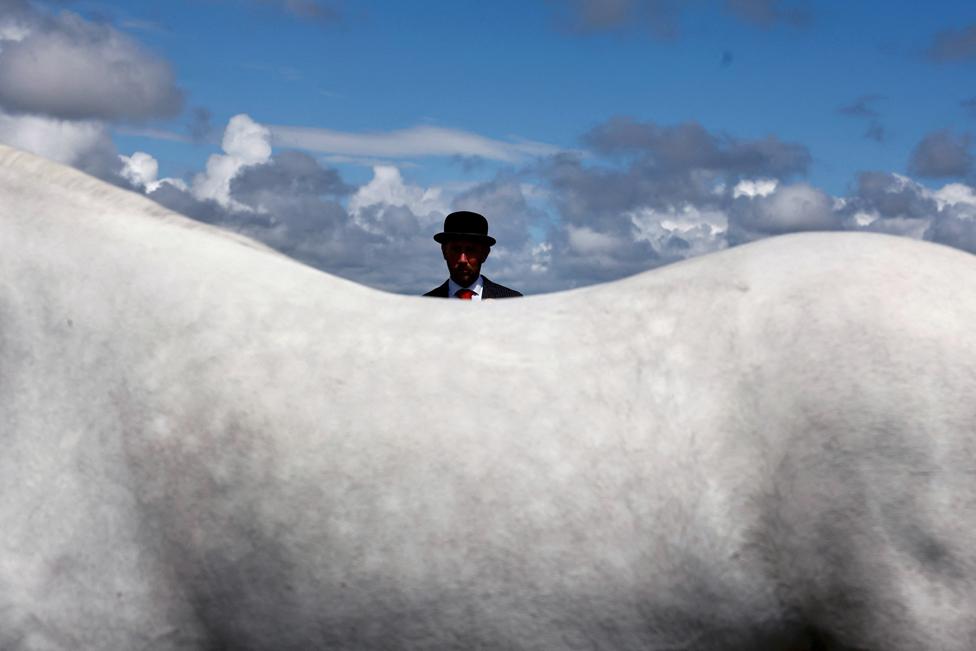 Judge Vincent Holian looks on during the yearling filly class at the Roundstone Connemara Pony Show, in the County Galway village of Roundstone, Ireland, July 9, 2023.